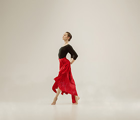 Image showing Modern ballet dancer dancing in full body on white studio background.