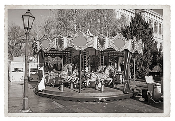 Image showing Old fashioned french carousel with horses Vintage Monochrome pho