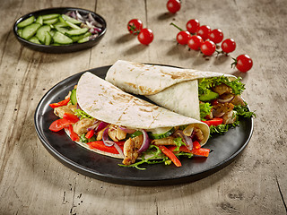 Image showing Tortilla wraps with fried chicken meat and vegetables