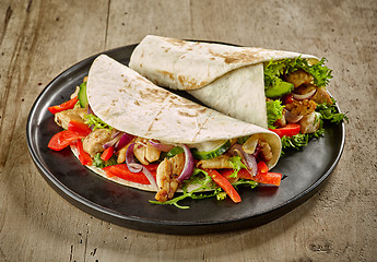 Image showing Tortilla wraps with fried chicken meat and vegetables