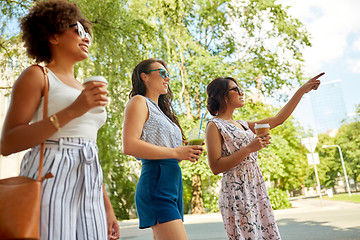 Image showing happy women or friends with drinks at summer park