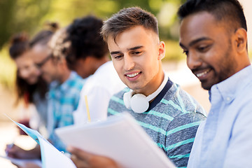 Image showing students with notebook outdoors