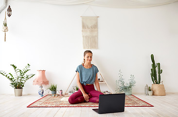 Image showing woman with laptop computer at yoga studio