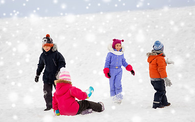 Image showing happy little kids playing outdoors in winter