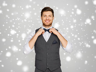 Image showing happy man in festive suit dressing for party