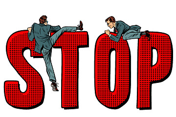 Image showing people climb on the word stop