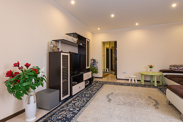 Image showing The interior of a spacious living room, entrance from the hallway