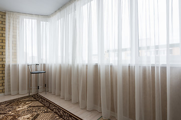 Image showing Curtained glazed spacious balcony in the apartment