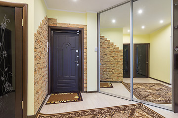 Image showing Spacious entrance hall in the apartment with built-in wardrobe and huge mirrors