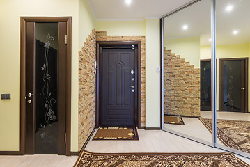 Image showing Spacious entrance hall in the apartment with built-in wardrobe and mirrors