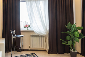 Image showing Interior element, bar stool, curtain windows, vase with flowers on the window