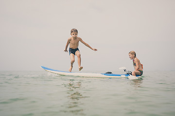 Image showing Happy children playing on the beach at the day time.