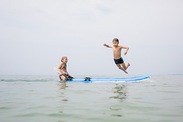 Image showing Happy children playing on the beach at the day time.