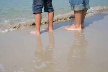 Image showing Father and son playing on the beach at the day time.