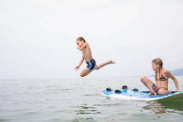 Image showing Happy children playing on the beach at the day time.