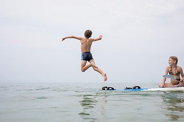 Image showing Happy children playing on the beach at the day time.