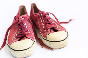 Image showing Old sneakers on a white background