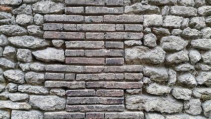 Image showing Ancient wall with bricks and cobblestones