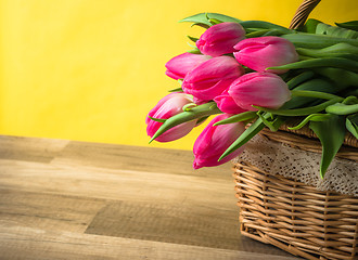 Image showing Beautiful bouquet of pink tulips in a wicker basket