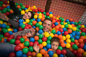 Image showing young parents with kids in a children\'s playroom