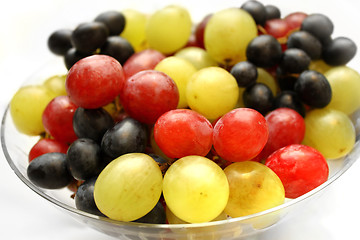 Image showing Bright assortment tasty ripe grapes in a glass plate