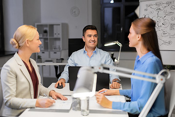 Image showing business team working at night office