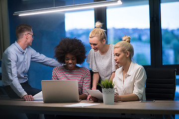 Image showing Multiethnic startup business team in night office