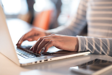 Image showing businesswoman using a laptop in startup office