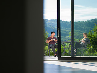 Image showing couple enjoying morning coffee and breakfast