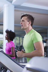 Image showing people exercisinng a cardio on treadmill in gym