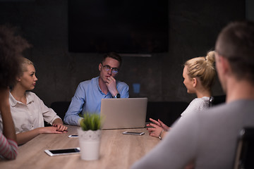 Image showing Multiethnic startup business team in night office