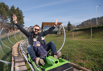 Image showing father and son enjoys driving on alpine coaster