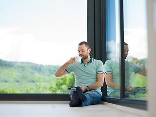 Image showing man on the floor enjoying relaxing lifestyle