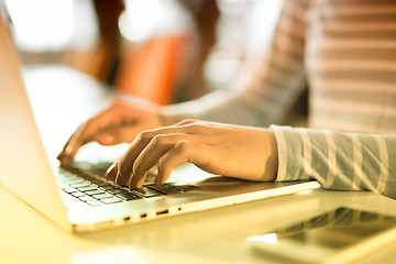 Image showing businesswoman using a laptop in startup office