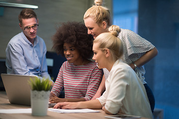 Image showing Multiethnic startup business team in night office