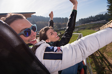 Image showing couple enjoys driving on alpine coaster