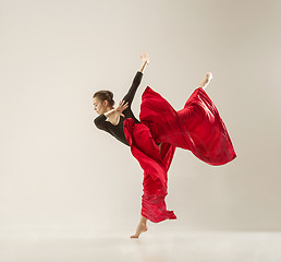 Image showing Modern ballet dancer dancing in full body on white studio background.