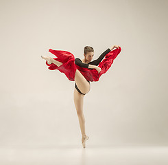 Image showing Modern ballet dancer dancing in full body on white studio background.