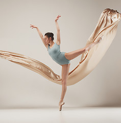 Image showing Modern ballet dancer dancing in full body on white studio background.