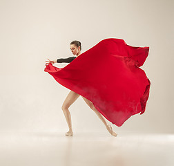 Image showing Modern ballet dancer dancing in full body on white studio background.