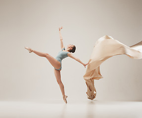 Image showing Modern ballet dancer dancing in full body on white studio background.