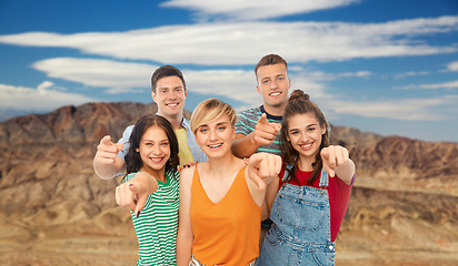 Image showing friends pointing at you over grand canyon