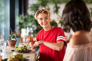 Image showing female friends eating at restaurant