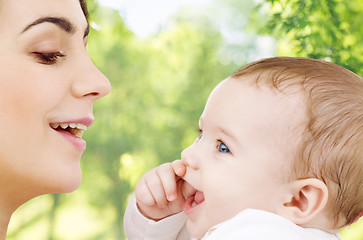 Image showing mother with baby over green natural background