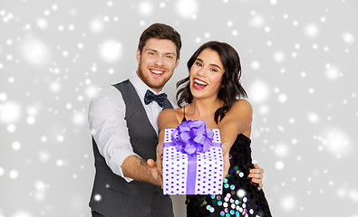 Image showing happy couple with christmas gift