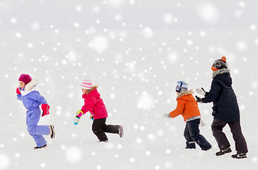 Image showing happy little kids playing outdoors in winter