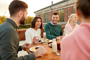 Image showing friends having dinner or rooftop party in summer