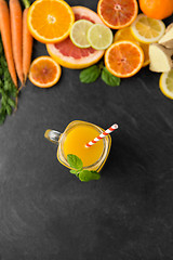 Image showing mason jar glass of fruit juice on slate table top