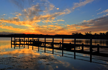 Image showing Beautiful sunset and timber jetty silhouette