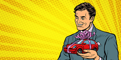 Image showing Businessman gives a gift, selling cars